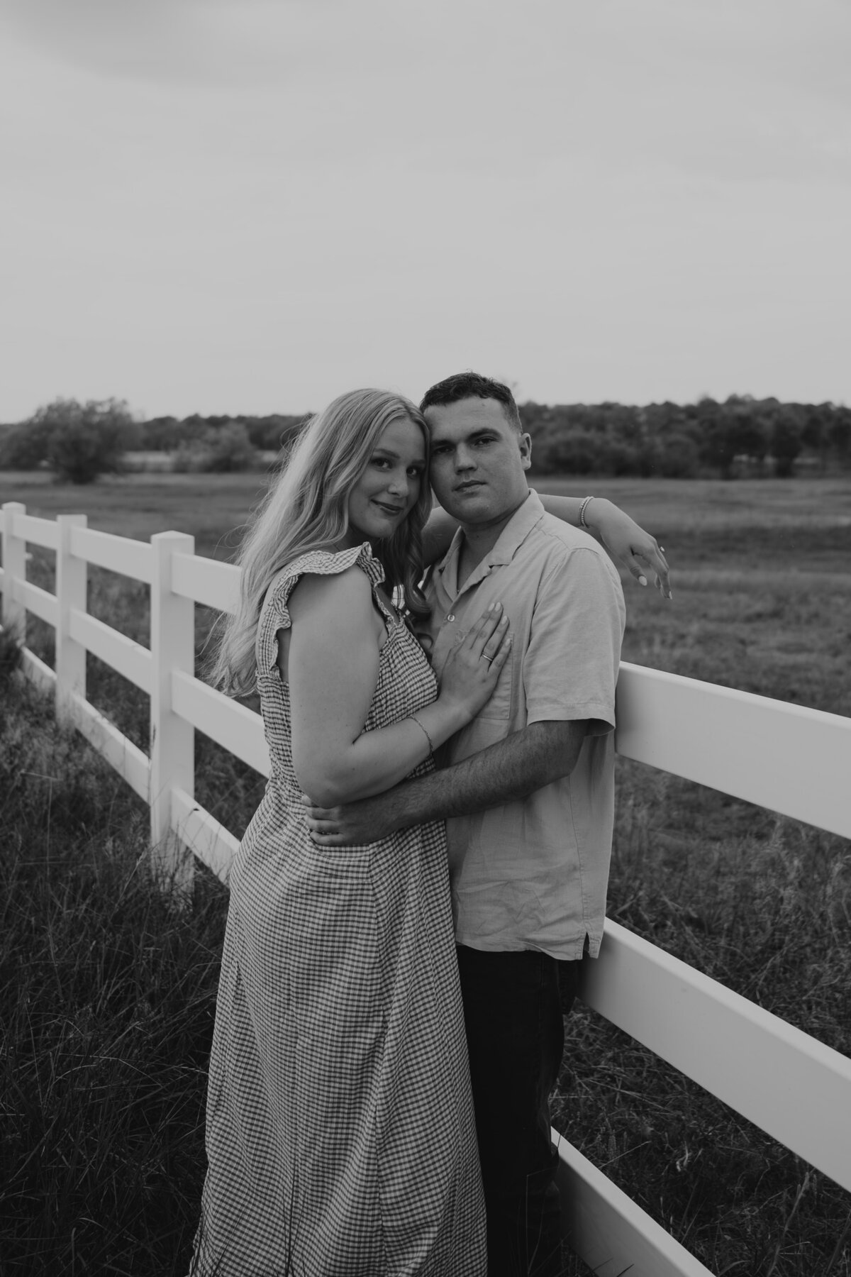 couple-snuggled-together-field