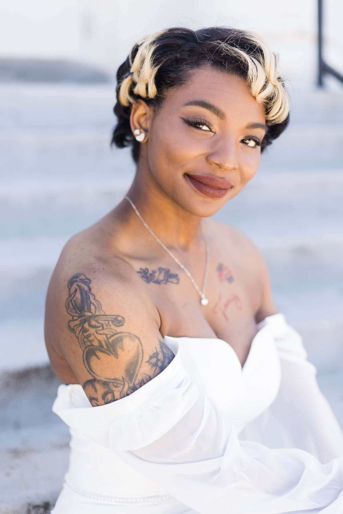 Bride with sweetheart neckline gown and tatoos