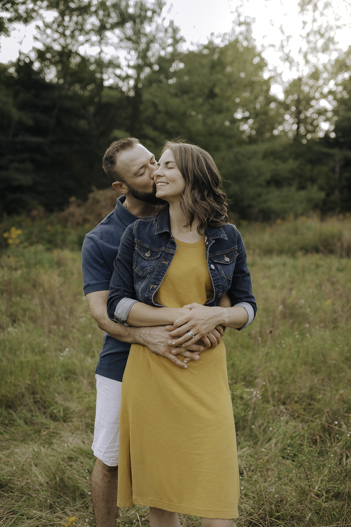 Verona B Photography captures a beautiful summer family photo of a Husband and wife embracing at Silver Creek Metro Park in Norton, OH. The love the couple had for each other was evident and it was so wonderful to capture this family in this beautiful lake setting near Akron.
