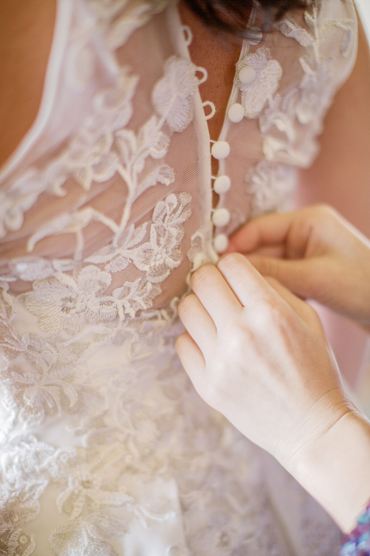 bridal dress being buttoned