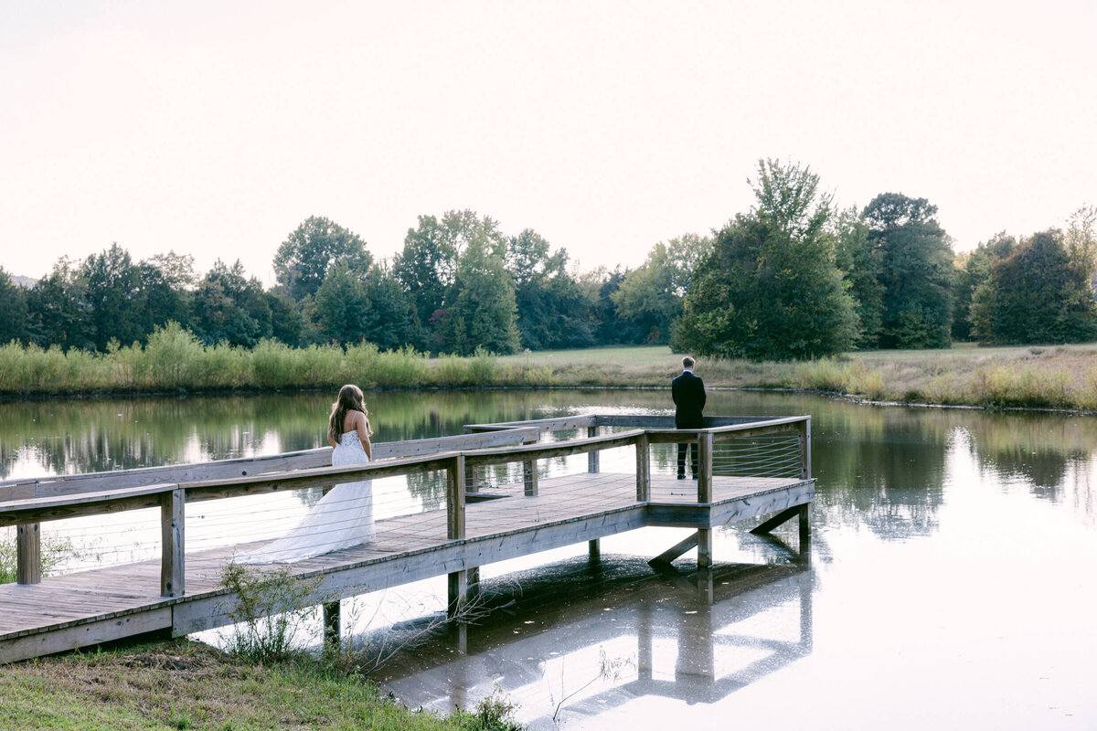 A wedding photo of a bride and groom during their first look