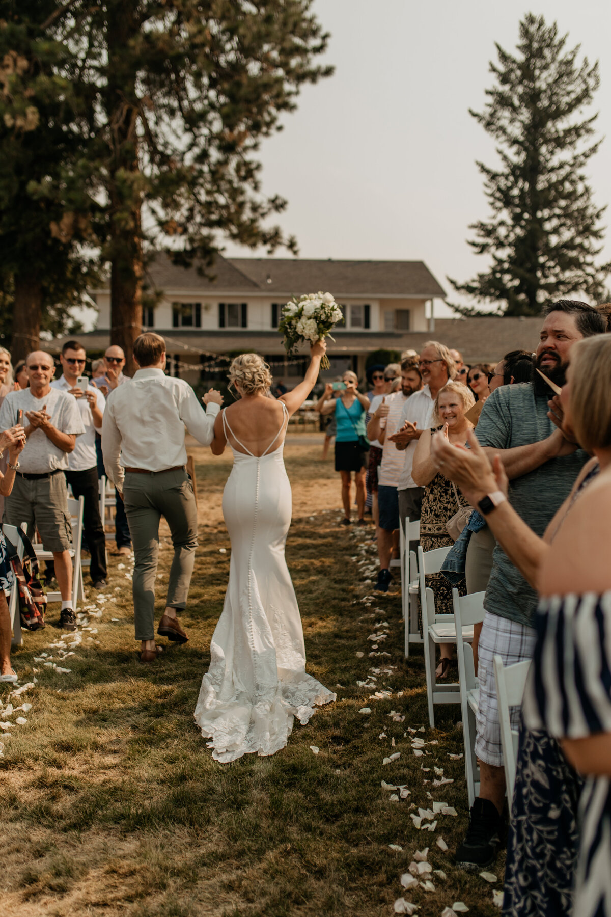 bride and groom walk back down aisle after saying I do
