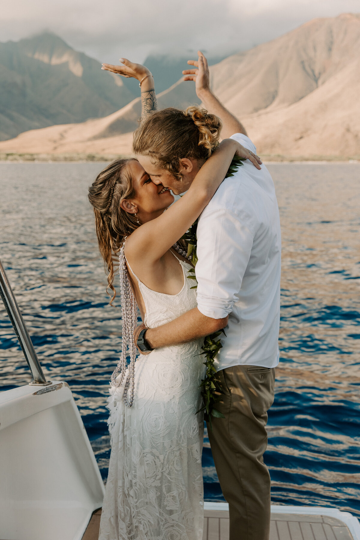 Maui Wedding Photographer captures bride and groom celebrating recent Maui beach wedding