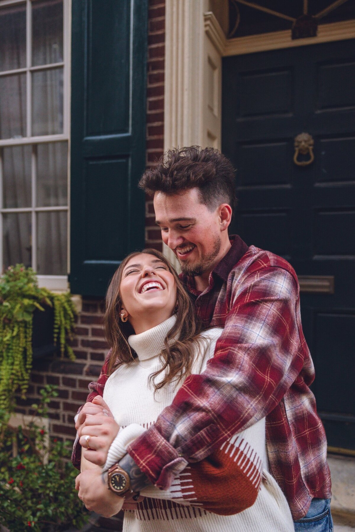 Romantic dip kiss in cobblestone alley of Old City Philadelphia.