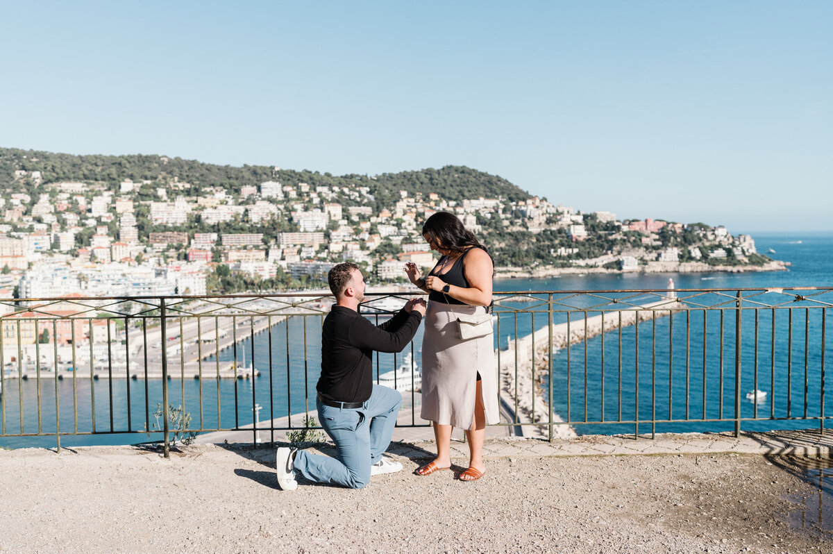 touching sunny surprise proposal with view of sea in nice france-04468