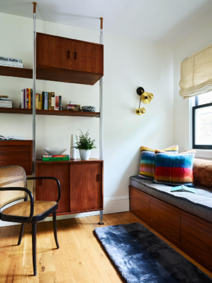 New walnut built-ins paired with vintage retro furniture at an interior decorating project in Brookline, Massachusetts, blending modern function with classic style.