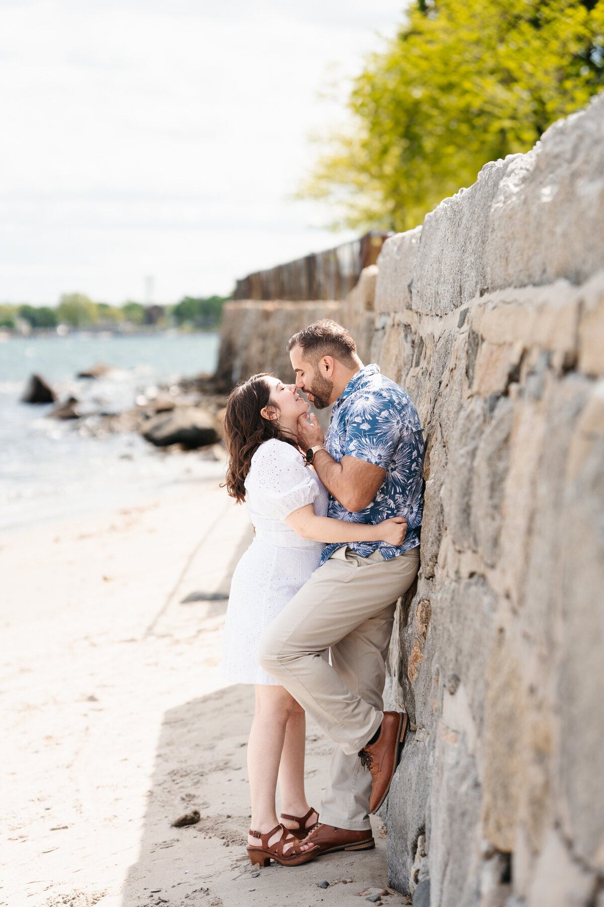 Couple walking through the rose garden at Lynch Park during their Beverly engagement session with Danielle Littles Photography