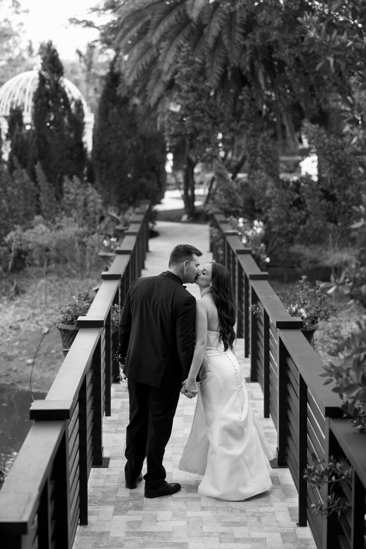 bride and groom walking away at La Casa Toscana Wedding Venue Fort Myers Florida