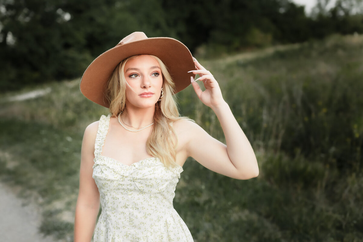 high school senior with sun hat