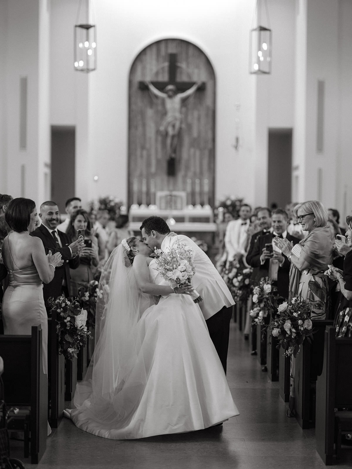 bride-groom-kissing-church-aisle-3GF-W