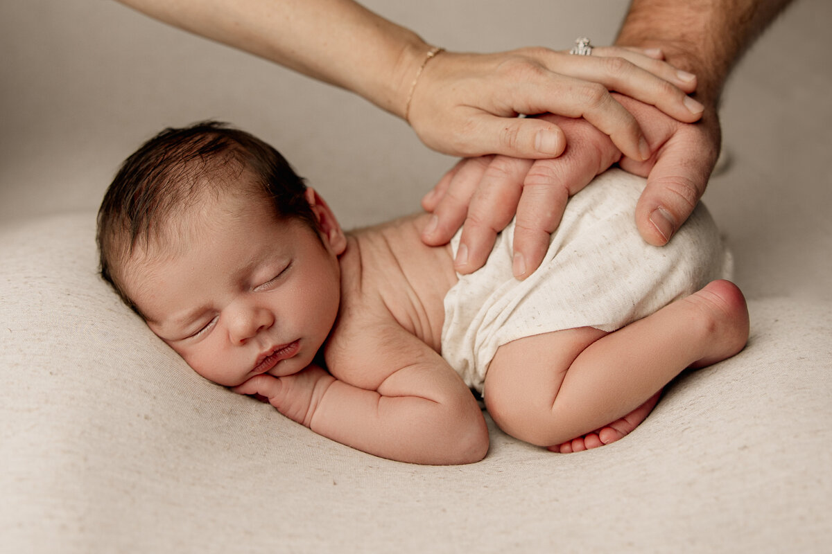 Newborn photography - baby holding a heart