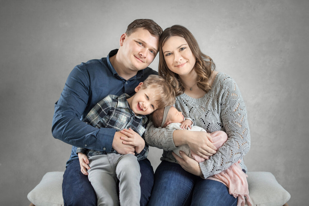 Family gets pictures taken by the best newborn studio photographer in New Jersey.