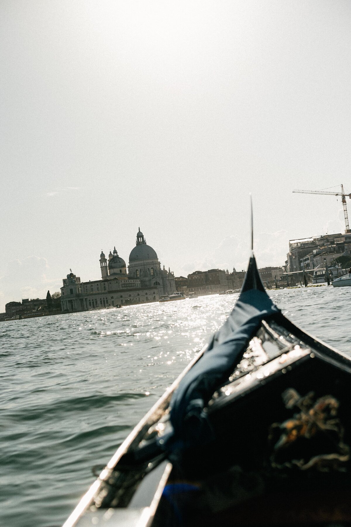 Editorial elopement photography in Venice with gondolas at sunset.