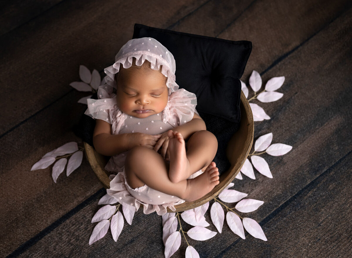 Newborn baby girl pink bonnet floral texture Lakeway photographer