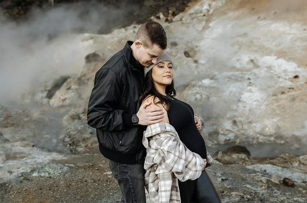 pregnant women and husband are hugging during their maternity photoshoot in Iceland