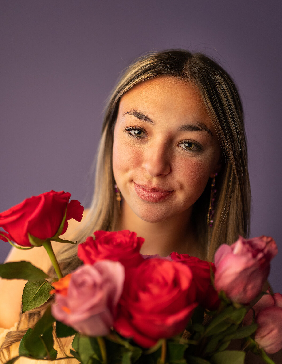 in studio senior pictures with fresh flowers