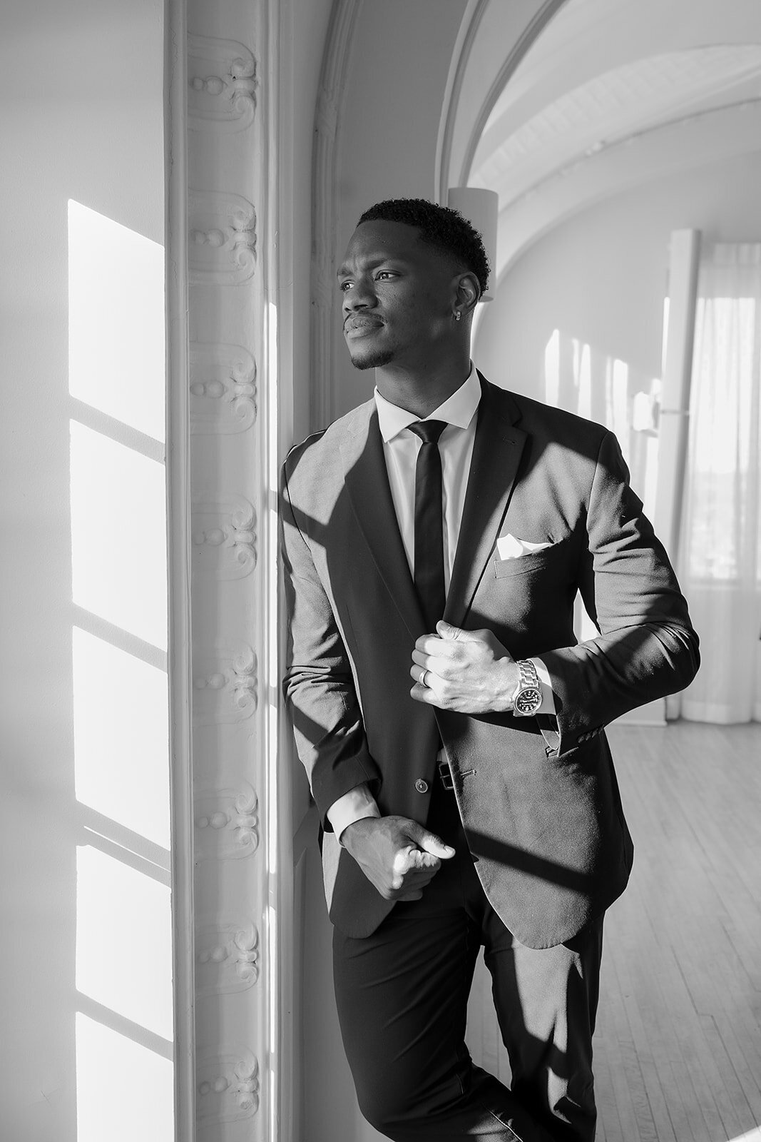 "Bride and groom celebrate their elegant luxury wedding at the historic Cottonwood Hotel in Omaha, NE – timeless moments captured by Tori Nichole Photography. A perfect blend of sophistication, romance, and architectural charm, showcasing the couple's love story in an unforgettable setting.
