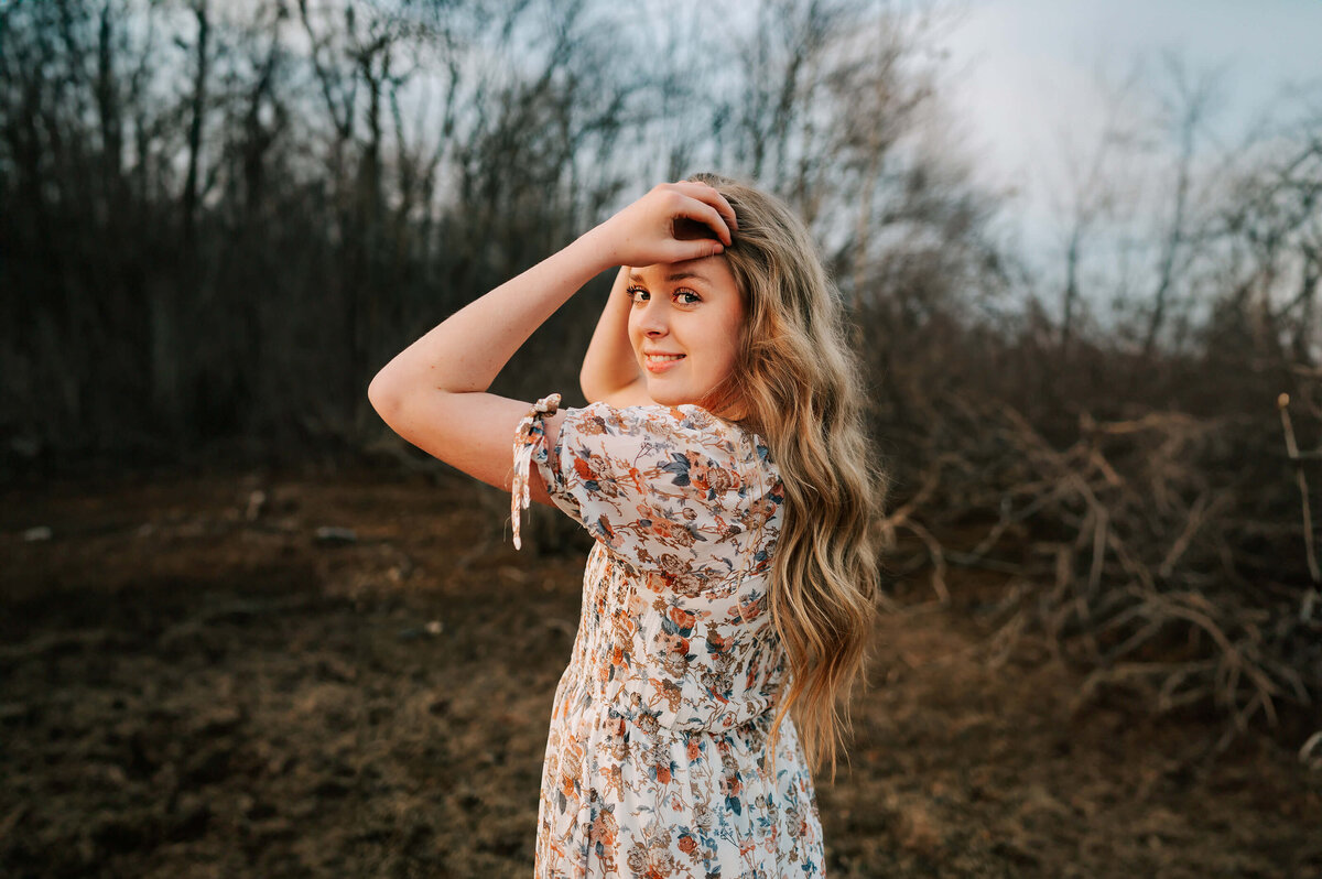 girl holding hair smiling outdoors by stockton lake missouri