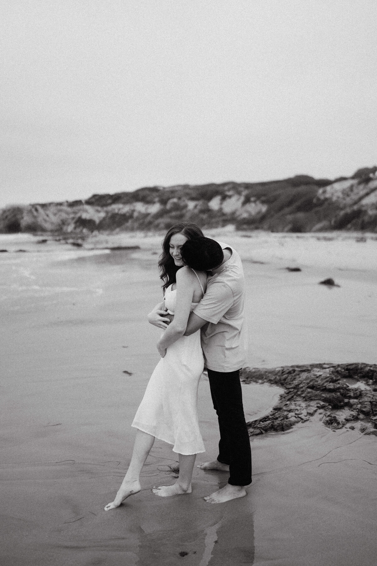 couple shoot for maternity session during golden hour Oregon coast beach wedding/elopement - photographed by The Storytellers