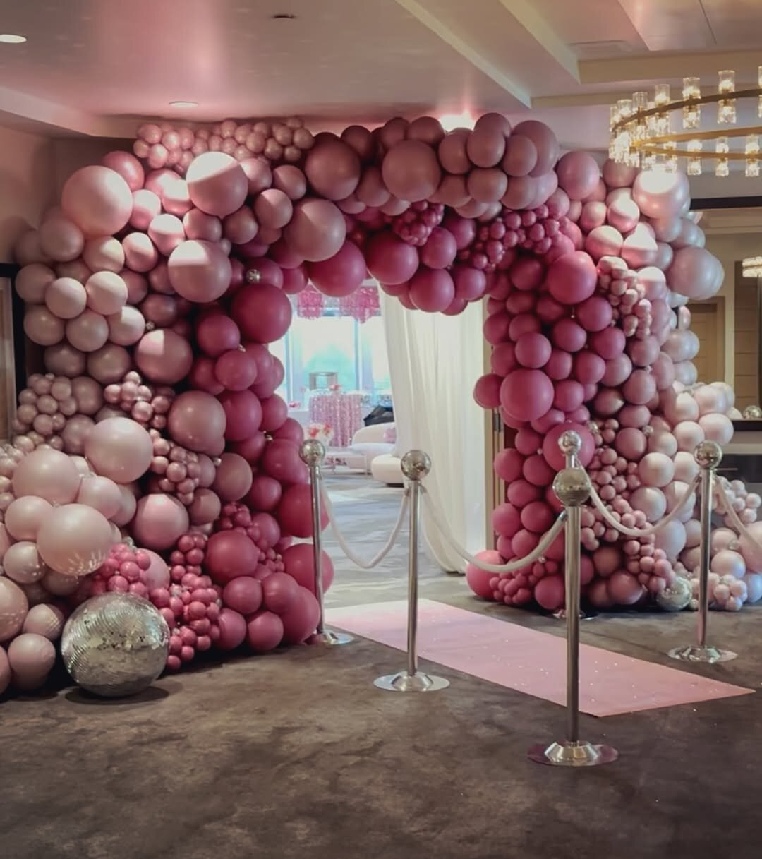 extravagant pink balloon arch for corporate event