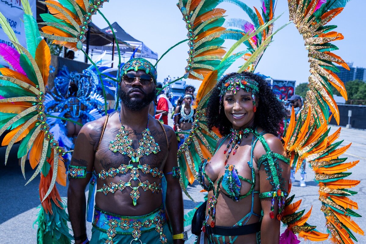 Toronto caribbean carnival parade masquerader in costume with Sunlime Mas, the number 1 medium size band at Toronto Carnival.