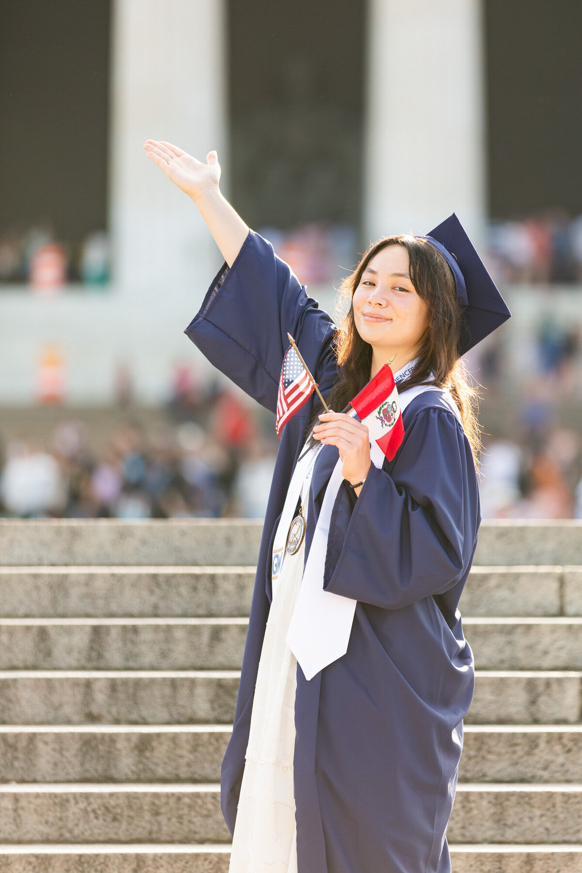 Peruvian and American flag holding at the Lincoln Memorial College graduation photo