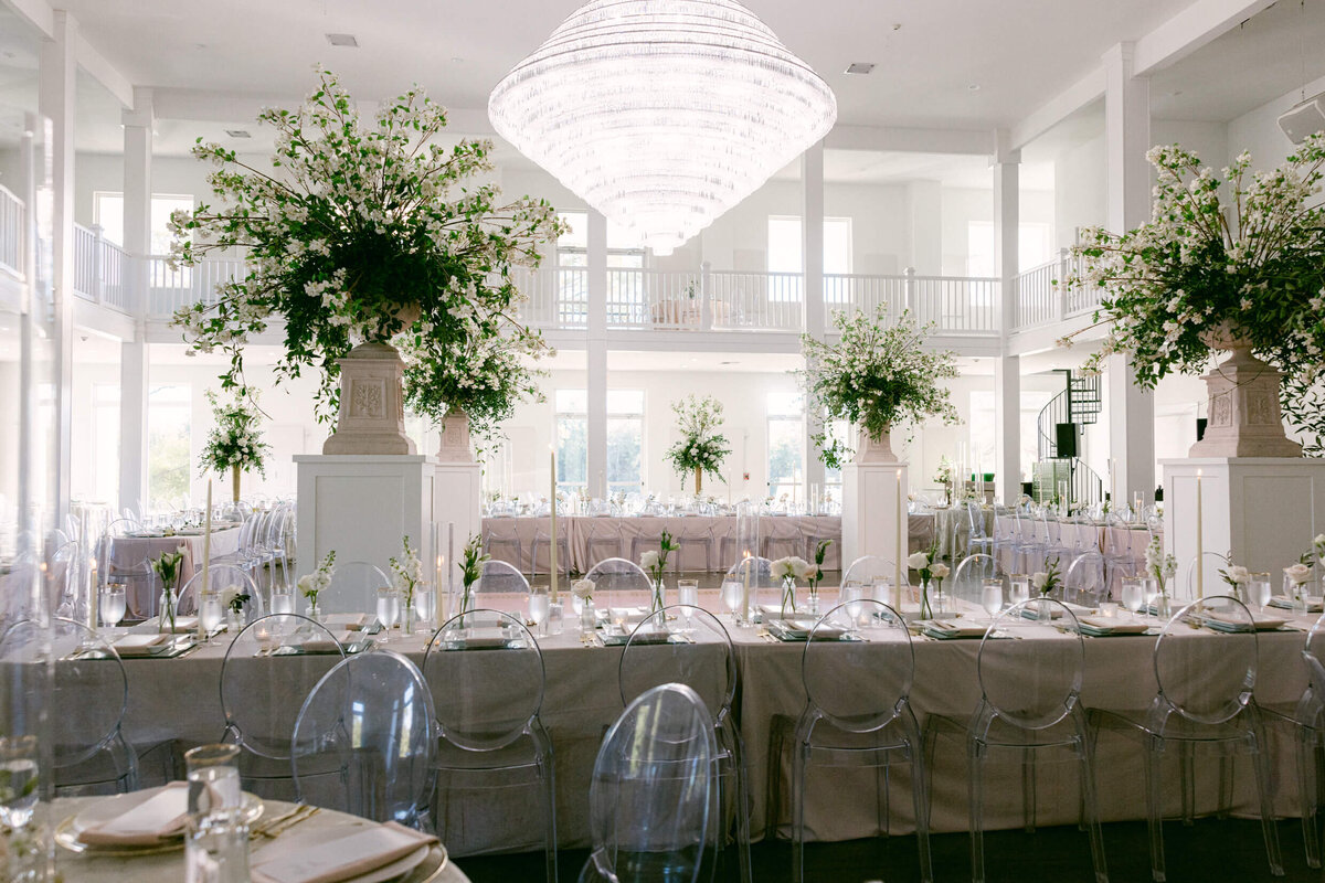 A wedding photo of the reception space showing off  florals and decorations