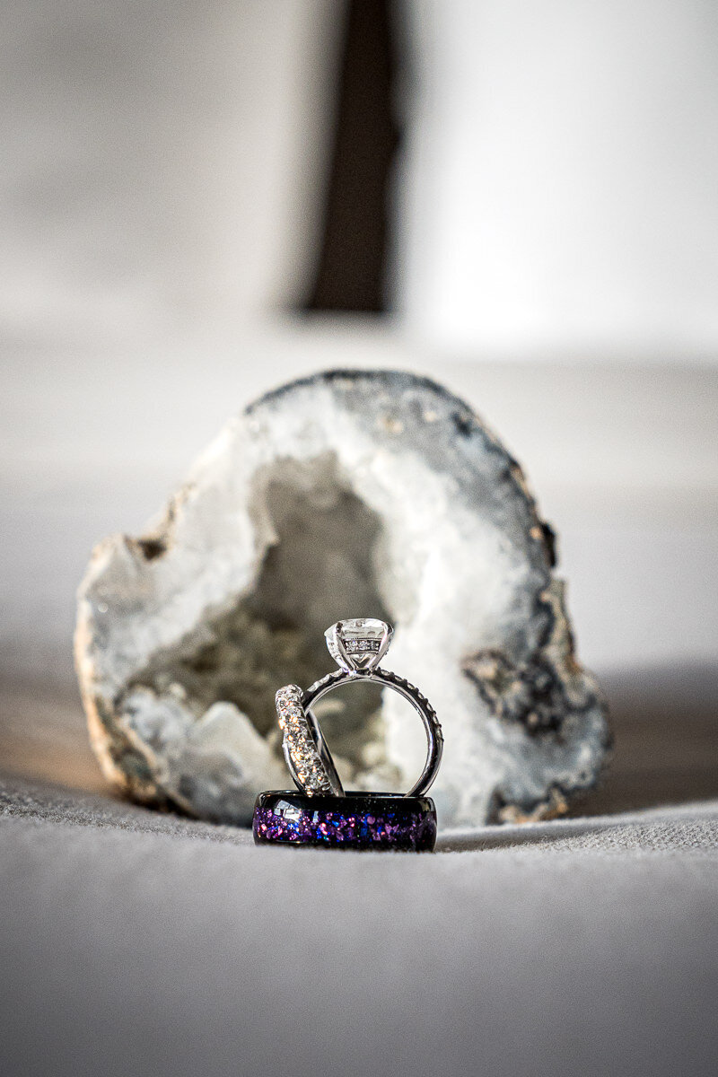 A close-up of the couple's wedding rings captured at the AC Hotel Pleasanton, showcasing timeless elegance and modern charm for their Northern California wedding day.