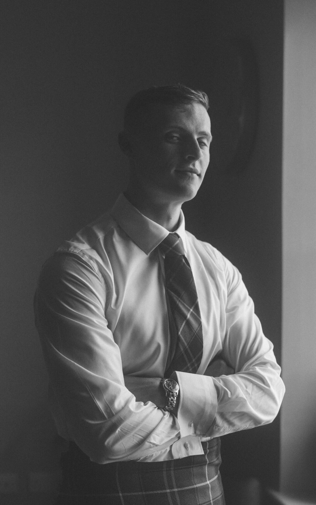 Wedding prep moments that reveal the anticipation and joy of a groom on his special day.