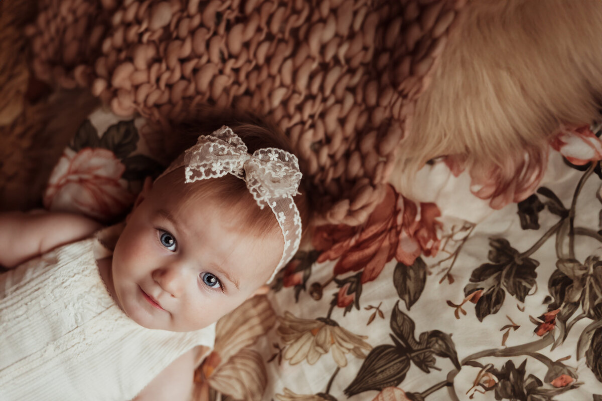 studio-portrait-of-child-on-textured-blankets