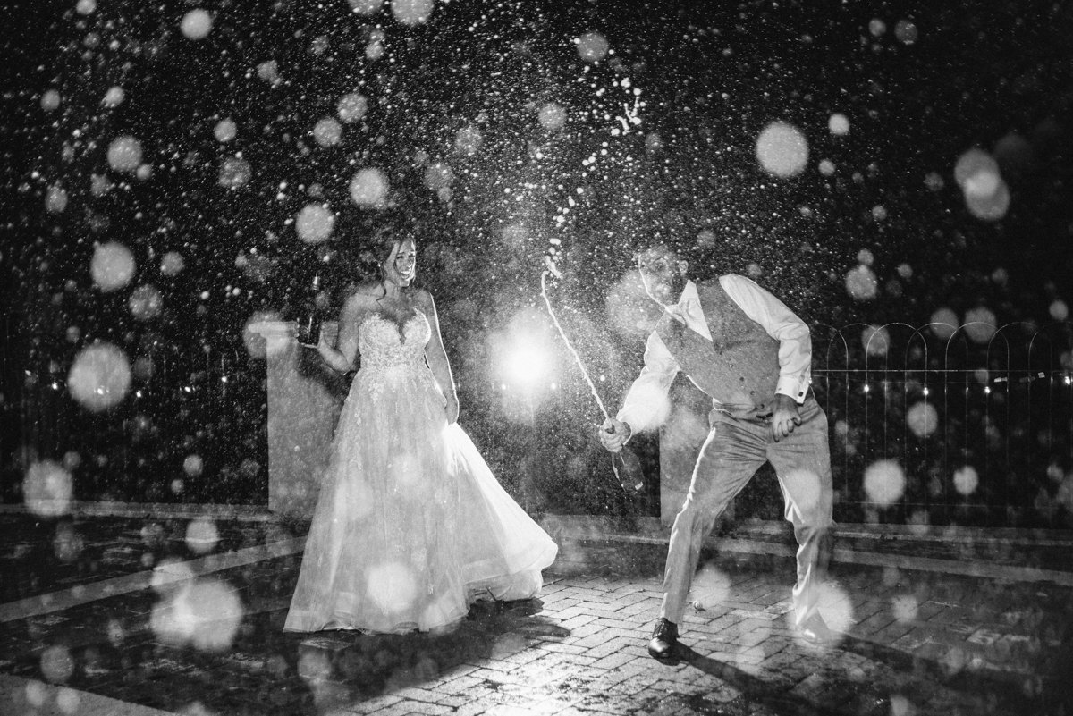 Champagne spray at a  Hotel Du Village wedding in New Hope PA