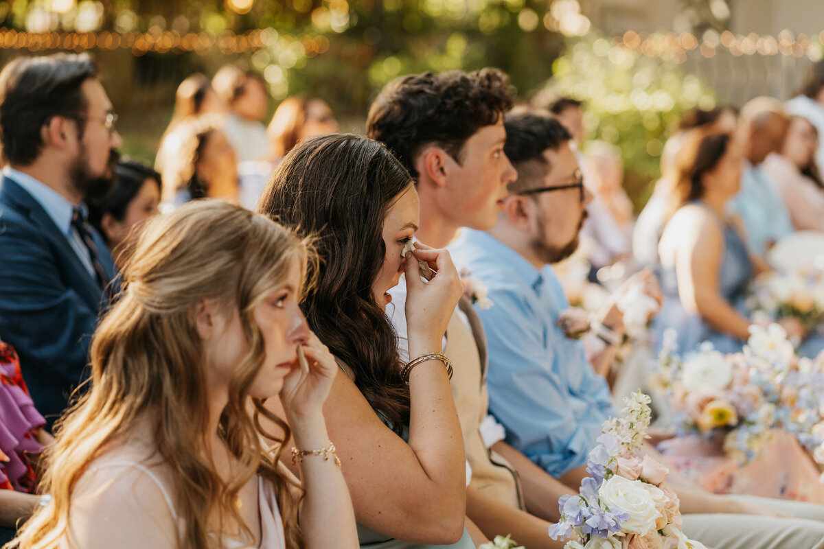 Guests crying during a wedding ceremony 