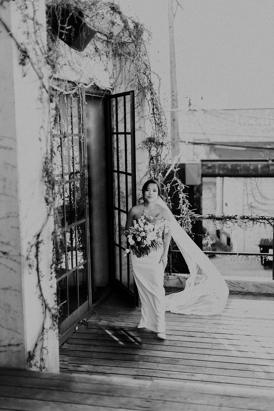 bride walking out onto deck for first look