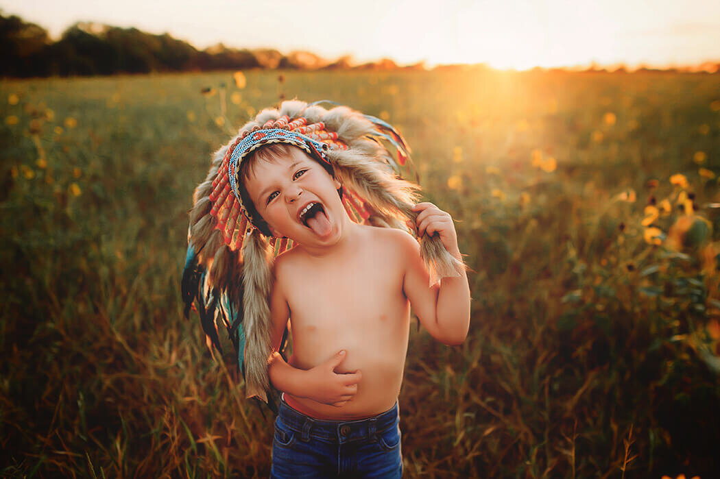 Little boy makes a silly face into the camera during Family Photoshoot in Asheville, NC.