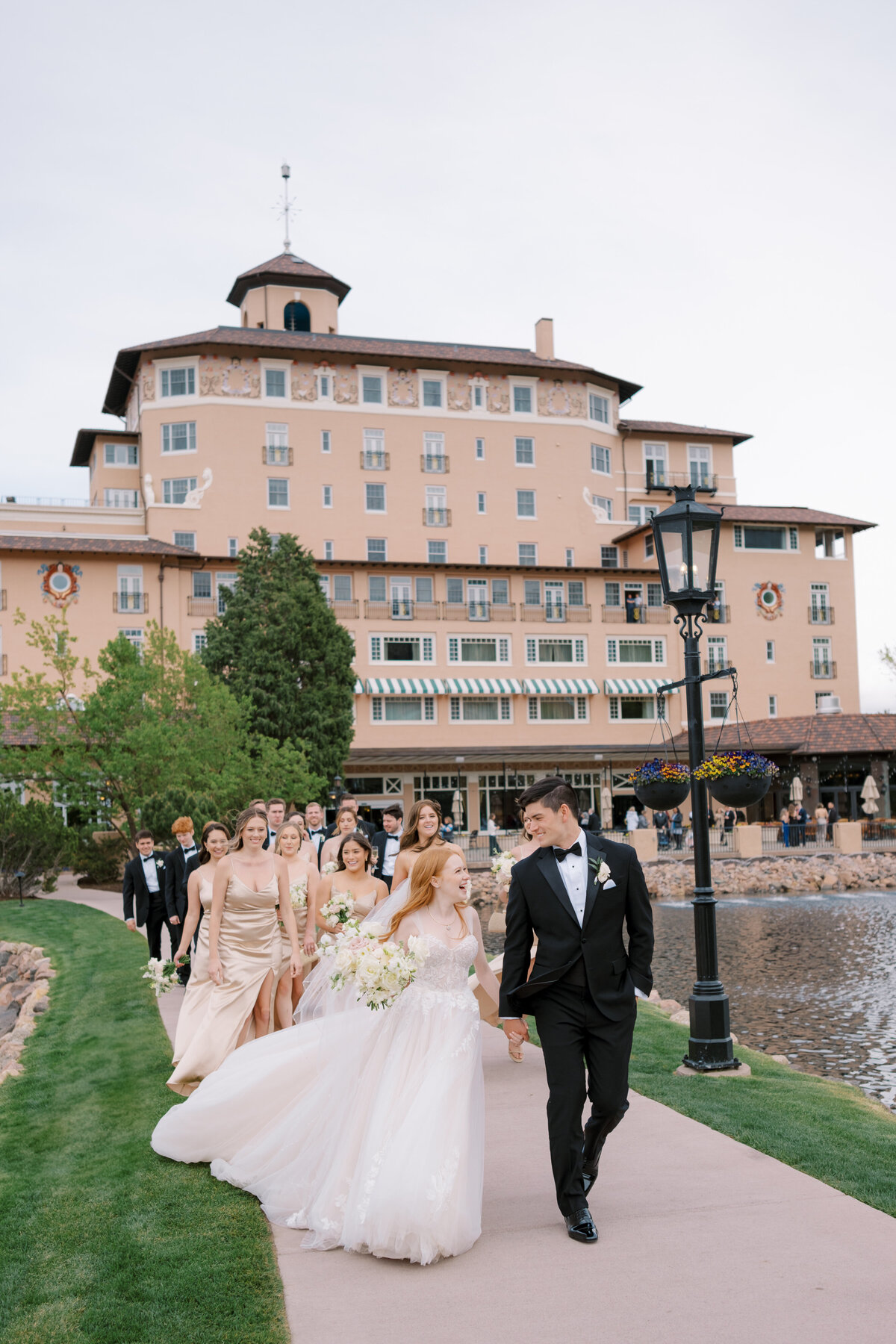 wedding party walking at The Broadmoor Resort in Colorado Springs, Colorado