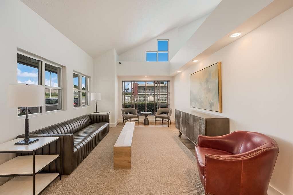Modern hotel lobby with rust colored lounge chair