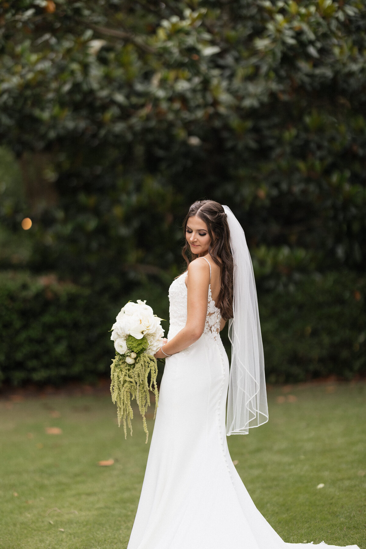 Bride admiring her bouquet from her florist.
