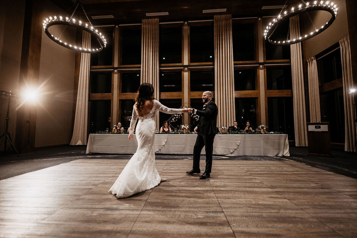 Couple’s first dance at ballroom wedding at The Malcolm Hotel, a modern romantic wedding venue in Canmore, featured on the Brontë Bride Vendor Guide.