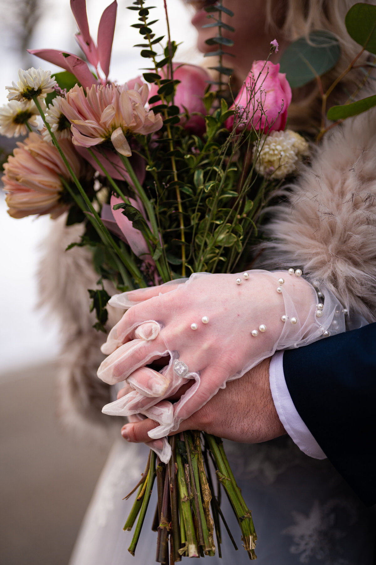 detail shot of beautiful pearl gloves worn on a wedding day