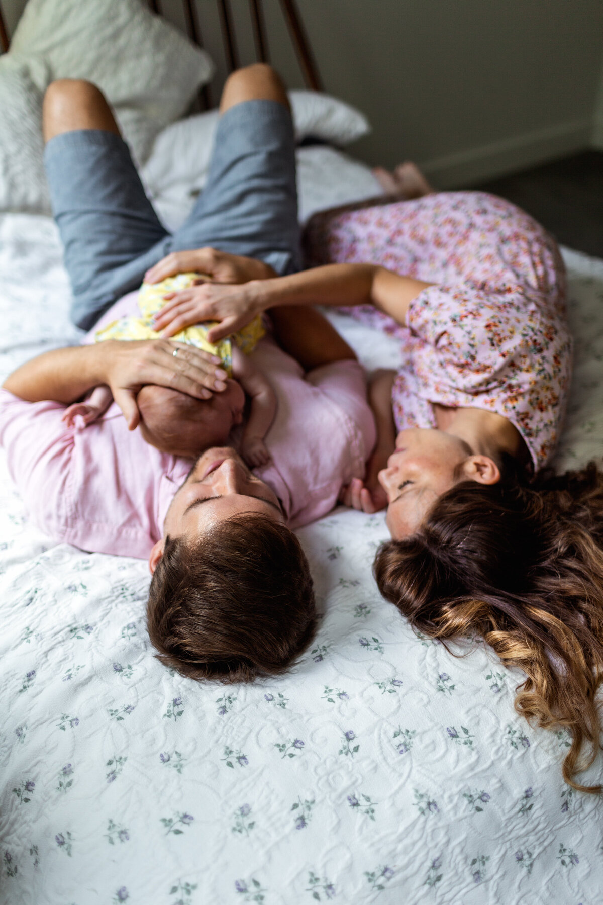 Family snuggles at home.