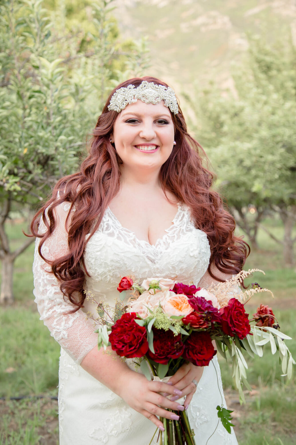 Happy bride in an apple orchard