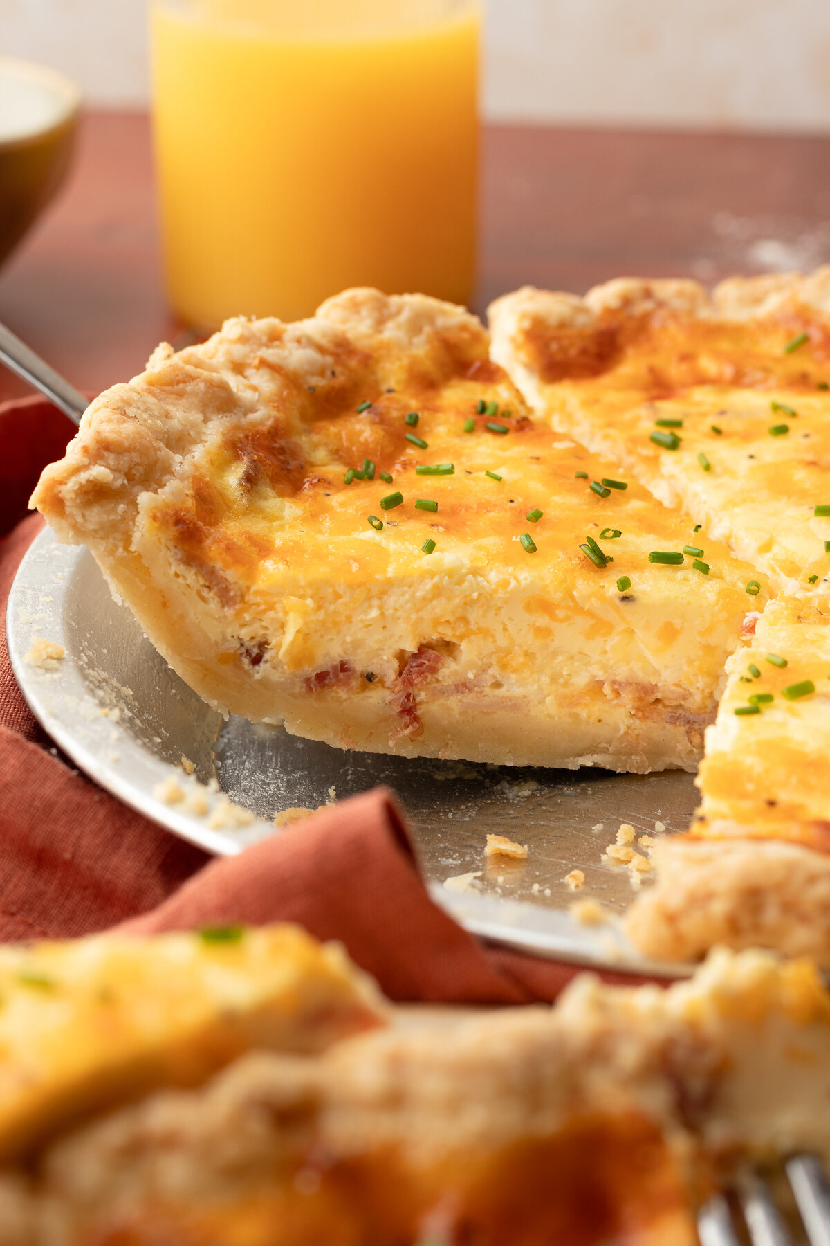 a quiche with a slice removed