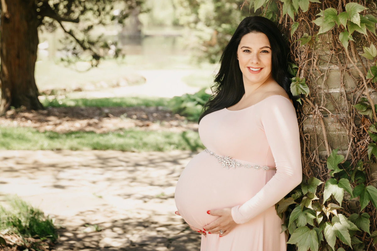 Pregnant mom in pink maternity gown
