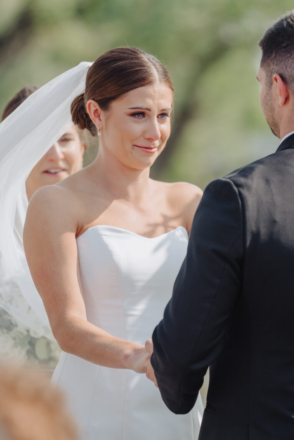 Bride and groom holding hands at Canandaigua Country Club, NY