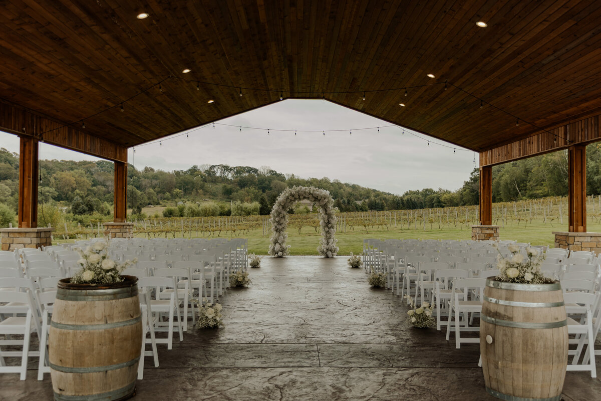 Wedding Venue in Minnesota with all white chairs and florals 