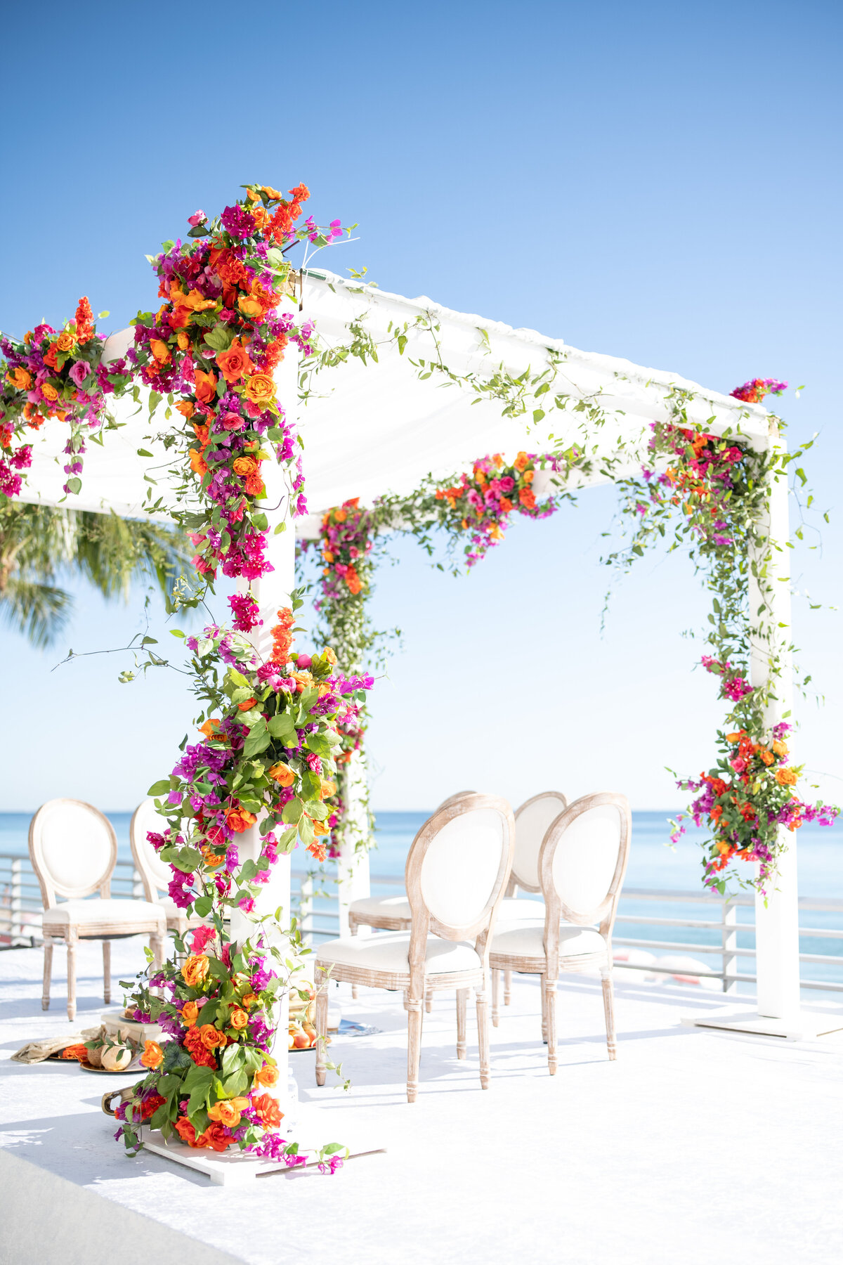 Flower covered arch on Naples beach
