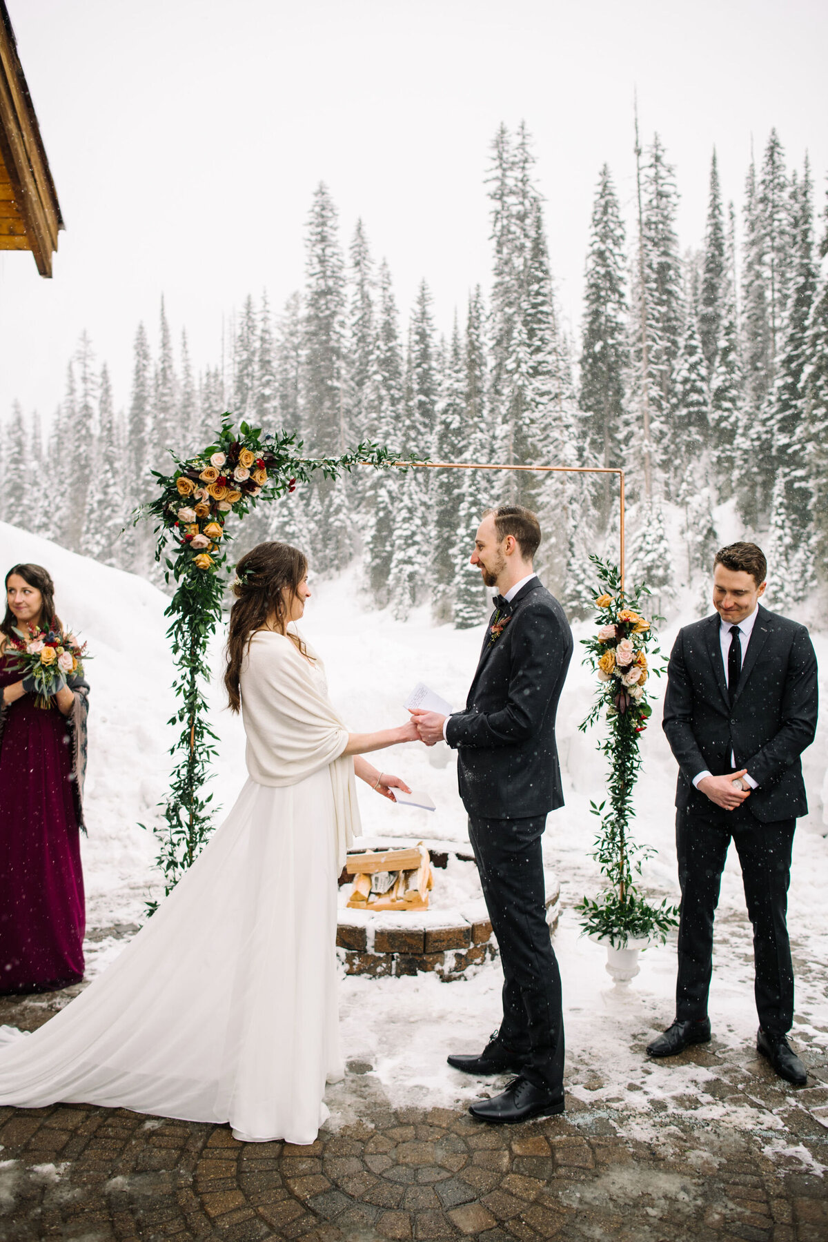 Outdoor winter wedding at Emerald Lake Lodge, rustic and classic Field, British Columbia wedding venue, featured on the Brontë Bride Vendor Guide.