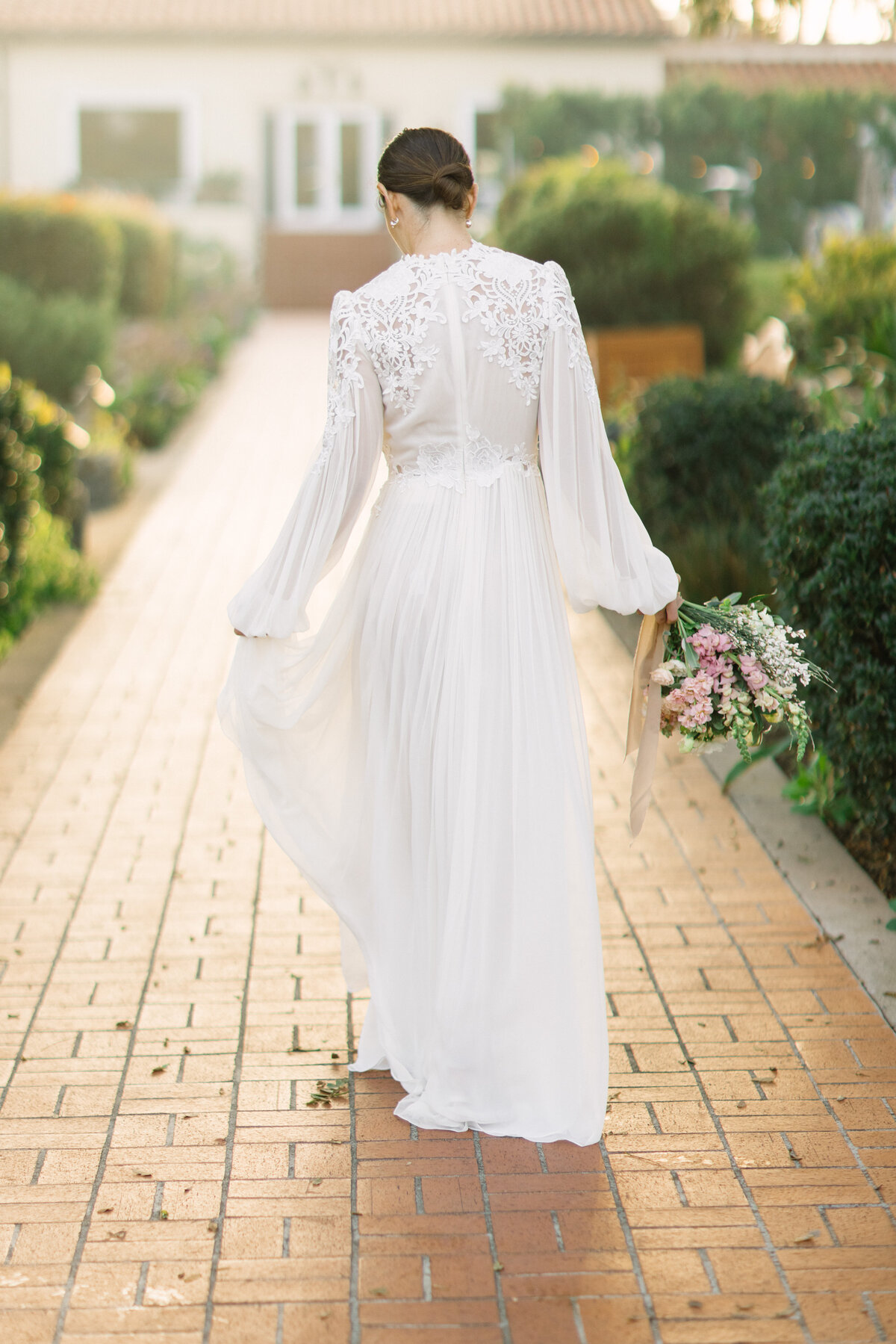 Bride in a dress with a bouquet in her right hand