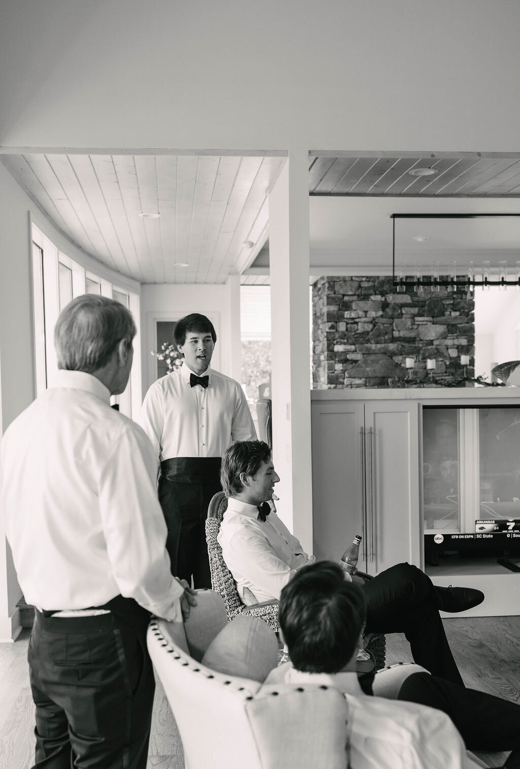 Groom and groomsmen getting ready in a modern Highlands NC home before their fall wedding at The Bascom Center.