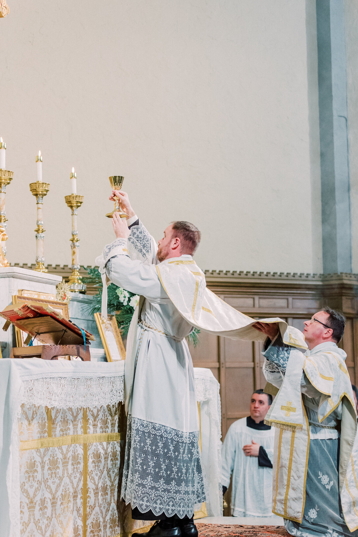 Elevation of the Chalice during Catholic Latin Mass wedding at Most Precious Blood Catholic Church in Pittsburgh